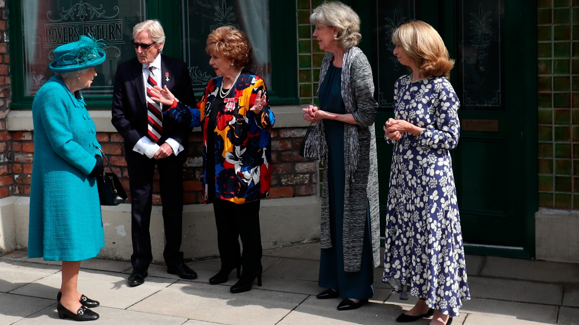 Queen Elizabeth II with Coronation Street stars William Roache, Barbara Knox, Sue Nicholls, and Helen Worth